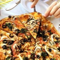 Vegan pizza (medium size): tomato sauce, vegan cheese, mushrooms, olives, onion, tomato, spinach and garlic at Martelli Pizza Italian in Paphos