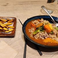 Hubby's spicy curry dish with a side of maple cajun sweet potato fries .   Yum at RUCY+R 横浜ジョイナス店 in Yokohama