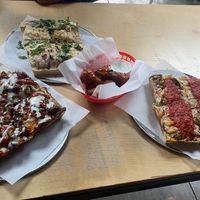 left to right: bbq bacon, ranch, jalapeño cheeseburger pizza.  bianca.  buffalo wings.    at Boxcar Pizza in Portland