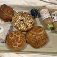 left side and top half vegan: seaweed focaccia, bagel with blueberry jam and veggie sandwich, bottom right two vegetarian  at Morethan Bakery in Tokyo