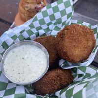Thick-cut glittery fried pickles with jalapeño ranch at HapPea Vegans in Austin