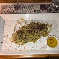 Spaghetti broccoli, aglio nero e polvere di oliva   at Status Quo in Rome