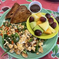 Tofu scramble with a side of fruit bowl and wheat toast.   at Flying Biscuit Cafe in Birmingham