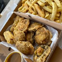 Vegan curry sauce, battered sausages and mushrooms with traditional chip shop chips!  at Lewis's Fish & Grill in Maidstone