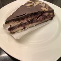 Berry cake: banana - coconut pancake layers with cashew and bounty cream, raw berry jam and chocolate on top   at Healthy Mania in Phuket