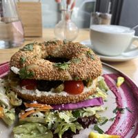 Simit with homemade almond ricotta and veggies   at The Garden Cafe & Restaurant in Budapest