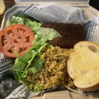 Alcapurria combo - fried plantain fritter stuffed with beyond meat and yellow rice with pigeon peas at 100% HP in San Juan