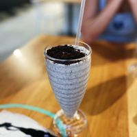 Cookies n creme milkshake. This is 1/2 portion because the nice server split it into two cups for me and my daughter.   at 100% HP in San Juan