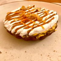 Pumpkin pie: chocolate pate sablee, pumpkin cream with chocolate drops, walnut and cinnamon pralines, orange zest  at Nativa in Rome