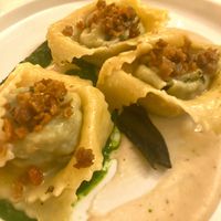Tortelli filled with black cabbage and vegan mozzarella, crunchy seitan, with cannellini beans and black cabbage creams  at Nativa in Rome