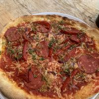 ‘Sala Mommy’ with s*lami, red onion, tomato sauce, homemade cheese, rosemary garlic oil, cress  at Vegan Pizza Bar in Rotterdam