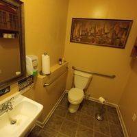 Restrooms (step to get into the bathroom) at Raw Can Roll Cafe in Wayne