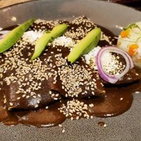 ENCHILADAS DE MOLE DON LUIS, RELLENAS DE FLOR DE JAMAICA CON ARROZ ROJO at Ojo de Maíz in Mexico City