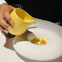 Adding in pistachio saffron milk  at Haoma in Bangkok