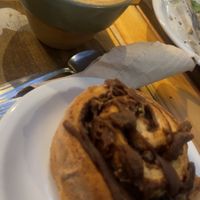Cappuccino and Chocolate cinnamon roll.  at Oso Blanco in Mar Del Plata