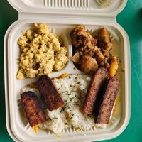 Vegan eggs, potatoes, grits with cheese and sausage at C4Eats in Hollywood