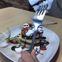 Pancake stack with chocolate sauce, strawberries, marshmallows and icecream  at Vegan Earth in Ayr