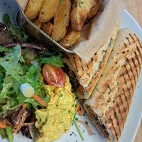 Seitan steak and caramelised onion panini & fries at Vegan Earth in Ayr