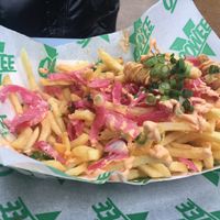 Half eaten Sriracha Loaded Shrimp Fries  at Oowee Vegan in South West London