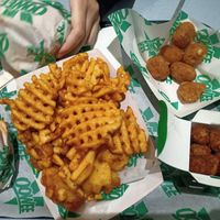 Garlic butter fries, pop corn chicken, chili cheese ball at Oowee Vegan in South West London