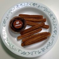 Cinnamon churros with chocolate sauce  at Oowee Vegan in South West London