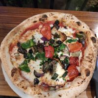 Vegan pizza with vegetables and mushrooms at Vegitalian - Schoutenstraat in Utrecht