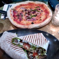 Wrap with mushrooms and pizza puttanesca at Vegitalian - Schoutenstraat in Utrecht