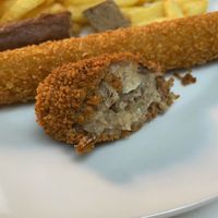 Fries with Vegetarian frikandal, chicken crunchy and vleeskroket. at De Blauwe Frituur in Kortrijk