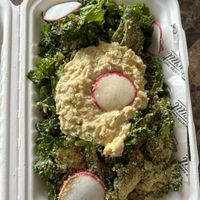 kale salad with chickpea salad on top   at Winter Park Biscuit Company in Orlando