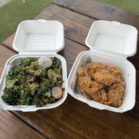 Side of kale salad and chicken tenders  at Winter Park Biscuit Company in Orlando