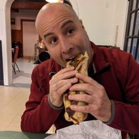 Husband devouring VGF falafelrrito at Veggie Oasis in Shokan