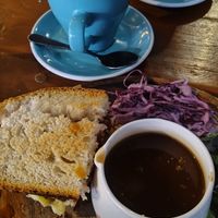 I ate half before I remembered to take a picture! 
Krampus tempeh, cheez & cranberry seasonal sandwich with dipping gravy 😋💚 at Koda Coffee in Scarborough