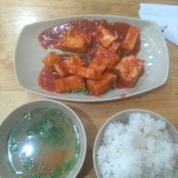 Sauted tofu with tomato sauce and rice at Hoang Nhi - P1 in Da Lat