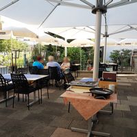 Outdoor seating with view of pond at Gasthof Rössli in Werdenberg
