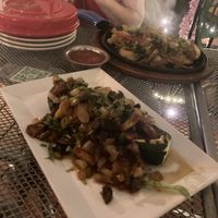 Stuffed zucchini with sizzling portabella veggie fajitas in the background   at Laredo in Washington