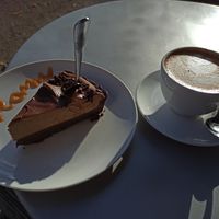 Bailey's tarte and oat-milk cappuccino at Creamy Cafe in Lublin