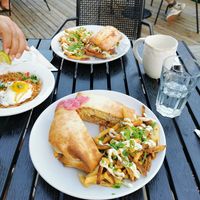 Vegan Hawaiian plate lunch crunch wrap, vegetarian pad Thai, and vegetarian grinder sandwich at Hopyard in Charlottetown