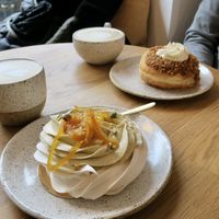 Pavlova with pistachio creme and hazelnut donut   at Eter Vegan Bakery in Warsaw
