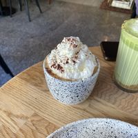 flat white with whipped cream   at Eter Vegan Bakery in Warsaw