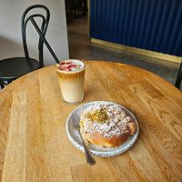 Rose ice latte and Pistachio brioche at Eter Vegan Bakery in Warsaw