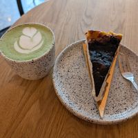 Matcha latte and cheesecake at Eter Vegan Bakery in Warsaw