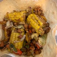 Her Tortilla basket with grilled corn, chickpeas & veggies at Michele's Vegan Kitchen in Lagos