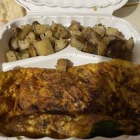 Vegan sausage, egg, peppers, spinach and cheese omelet with hash browns  at JMT Vegan Eats in Virginia Beach