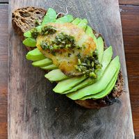 Avocado toast with vegan cheese and pesto at Botanica Garden Cafe in Tulum