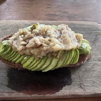 Avocado toast with vegan potato cheese   at Botanica Garden Cafe in Tulum