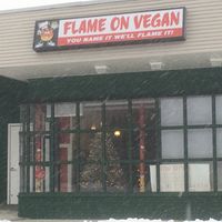 Festive window front in December snow! at Flame On Vegan in Agawam