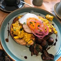 Tofu scramble in sourdough toast, garlicky spinach mushrooms and vegan egg - amazing! at The Vibe in Liverpool