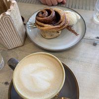 Warm cinnamon bun with vanilla ice cream + latte    at The Vibe in Liverpool