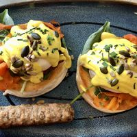 Veggs royale with side sausage  at The Vibe in Liverpool