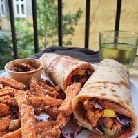 Sweet potato, fresh salad, raw red cabbage and herbs in like a chapatti wrap. Delicious! at uGood in Copenhagen